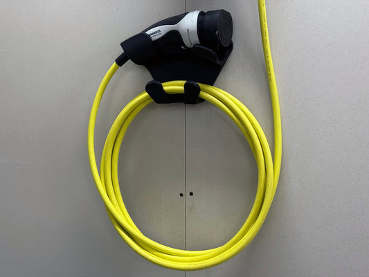 Wall-mounted universal EV charger organizer supporting charging handle and coiled cable