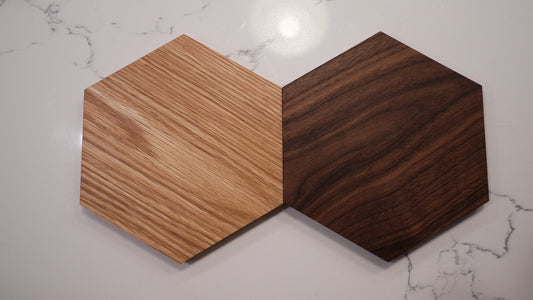Light oak and dark walnut hexagonal panels showing different natural wood grain