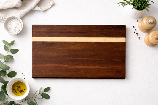 Edge-grain hardwood cutting board with walnut and maple accent inlay
