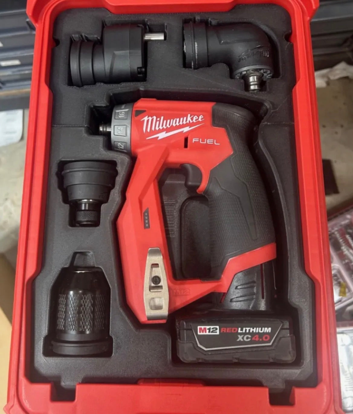 Milwaukee M12 FUEL 2505-20 drill driver and attachments organized in PACKOUT insert