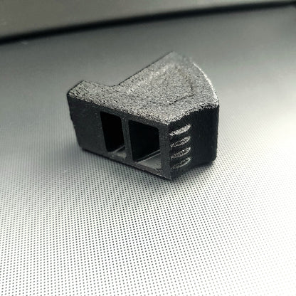 Close up of two vertical vent freshener clip receiving openings in black 3D printed Tesla vent adapter