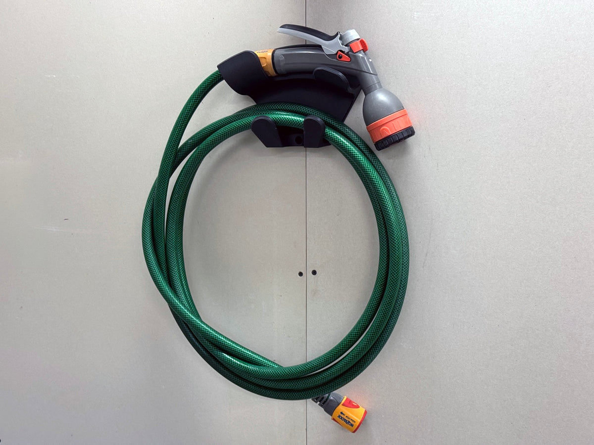 Versatile printed wall hook shown storing coiled garden hose
